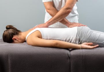 a chiropractor working on a patient
