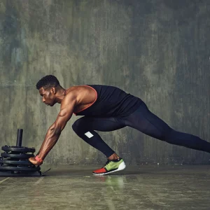 a man doing sled pushes