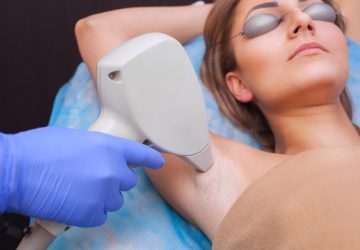 a woman getting laser hair removal in her armpit