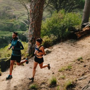 a couple running outdoors