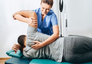 a physiotherapist treating a patient