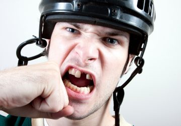 a hockey player missing a tooth