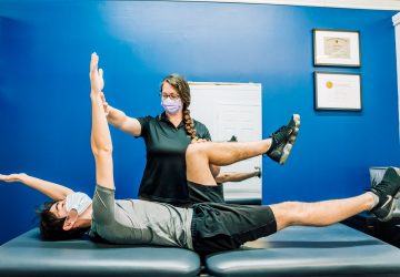 athletic therapist working with a client
