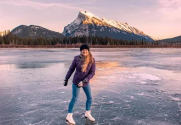 a woman skating on a lake