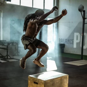 a man doing box jumps