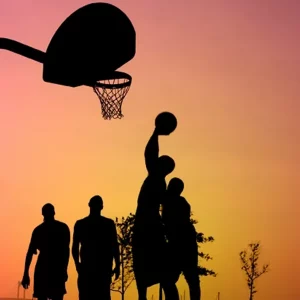 a group of athletes playing basketball