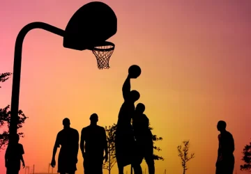 a group of athletes playing basketball