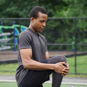 a man stretching before a workout
