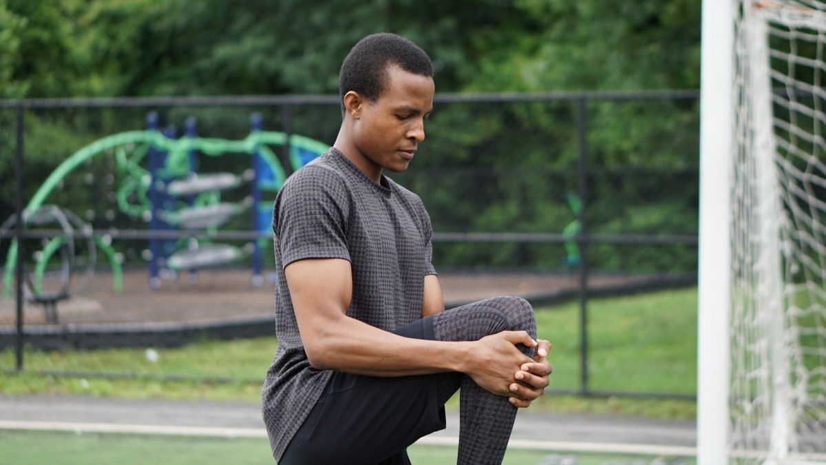 a man stretching before a workout