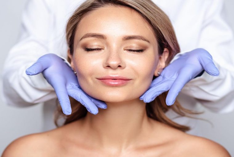 a woman getting a facial treatment