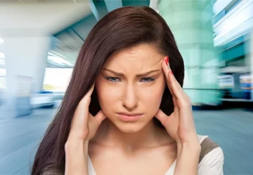 a woman experiencing a migraine