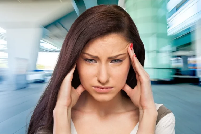 a woman experiencing a migraine