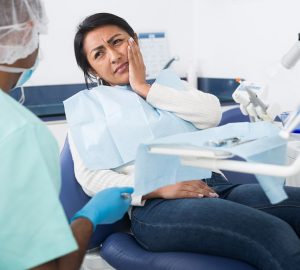 a woman experiencing tooth pain