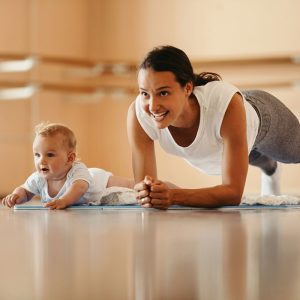 a woman working out with her baby