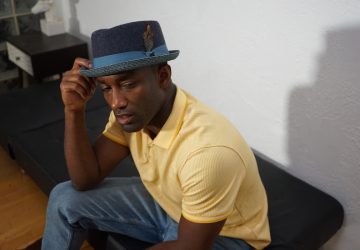 a man wearing a fedora hat