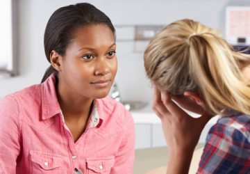 a woman talking to a counsellor