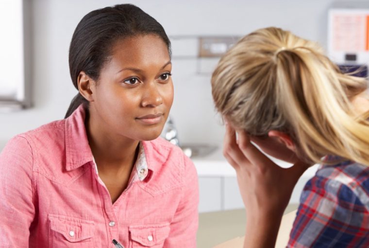 a woman talking to a counsellor