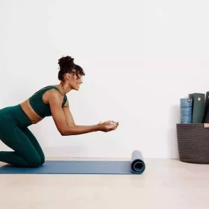 a woman doing yoga at home
