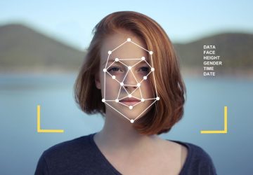 a woman being scanned using facial recognition