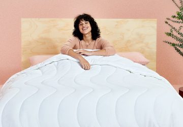 a woman getting a sleep with a nice comforter