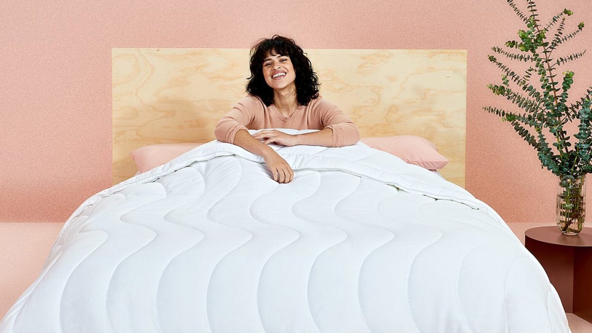 a woman getting a sleep with a nice comforter