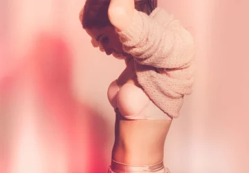 a woman looking at their body