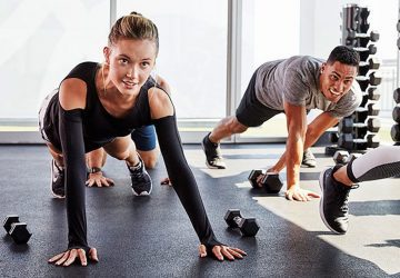a fit couple exercising in the gym