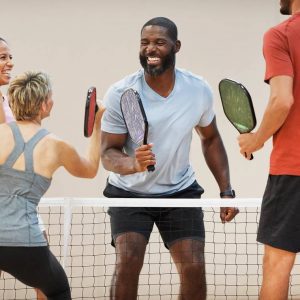 a group playing pickleball