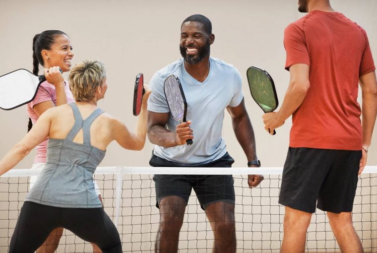 a group playing pickleball