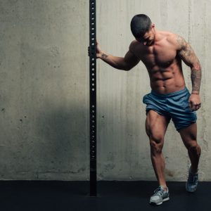 a man flexing his leg muscle