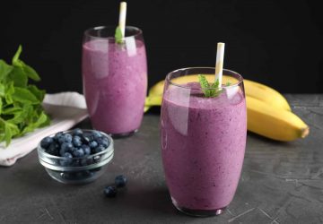 a health smoothie made with herbs, banana and blueberries
