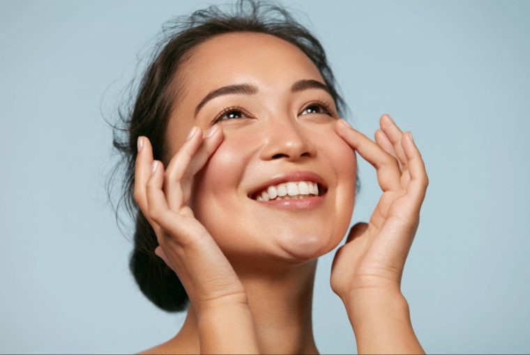 a smiling woman looking off into the distance