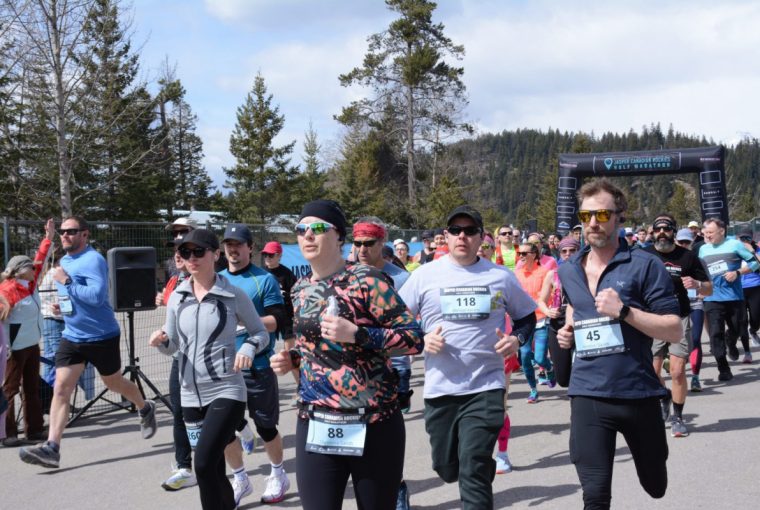a group of runners participating in a half marathon race