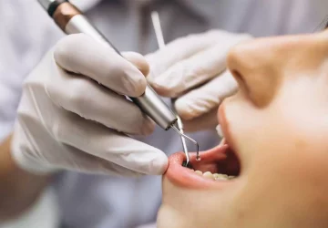 a woman receiving some dental work.
