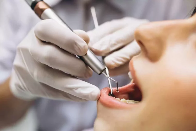 a woman receiving some dental work.