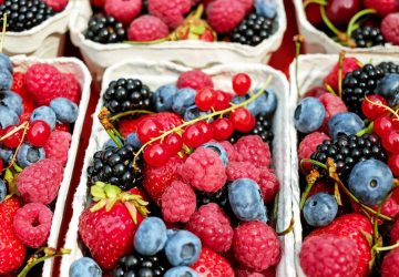 An assortment of berries in a container