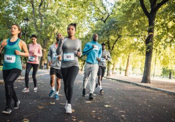 a group of runners training in a park