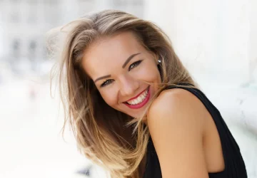 a beautiful woman smiling at the camera