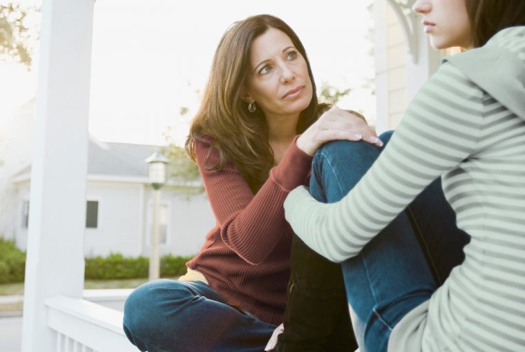 a mom talking to her teenage daughter
