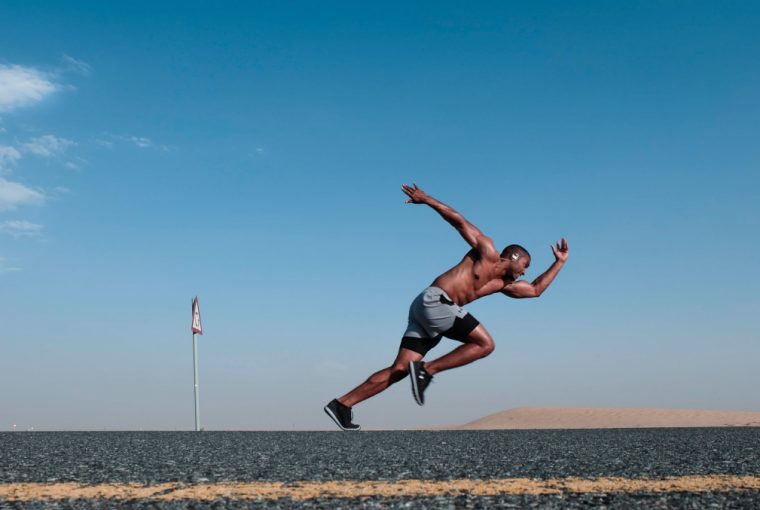 an athlete sprinting on a track