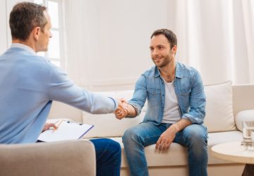 a man talking to a counsellor
