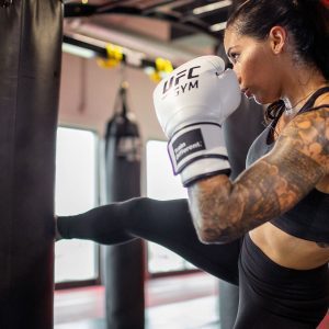 a woman training in MMA style