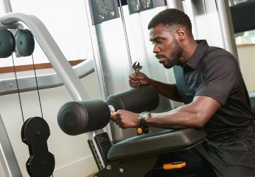 a man repairing fitness equipment