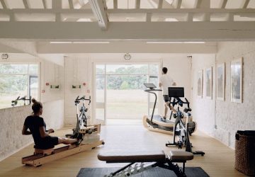 A home gym space with a couple working out in it