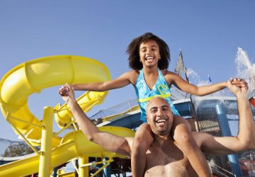 a daughter and her dad at a waterpark