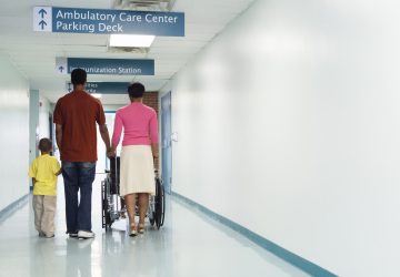 a family walking into a hospital