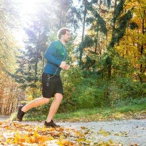 a couple running outdoors