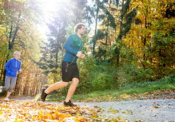 a couple running outdoors