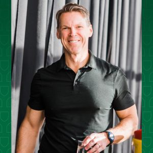 a man smiling at the camera