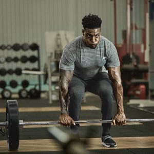 a strong man doing deadlifts